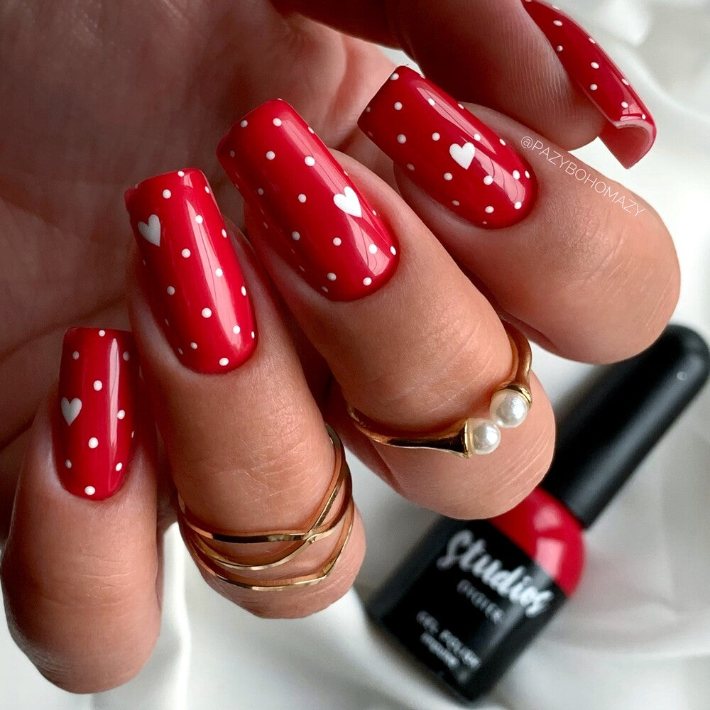 Studios Didier Lab Impulse red manicure with white hearts and dots